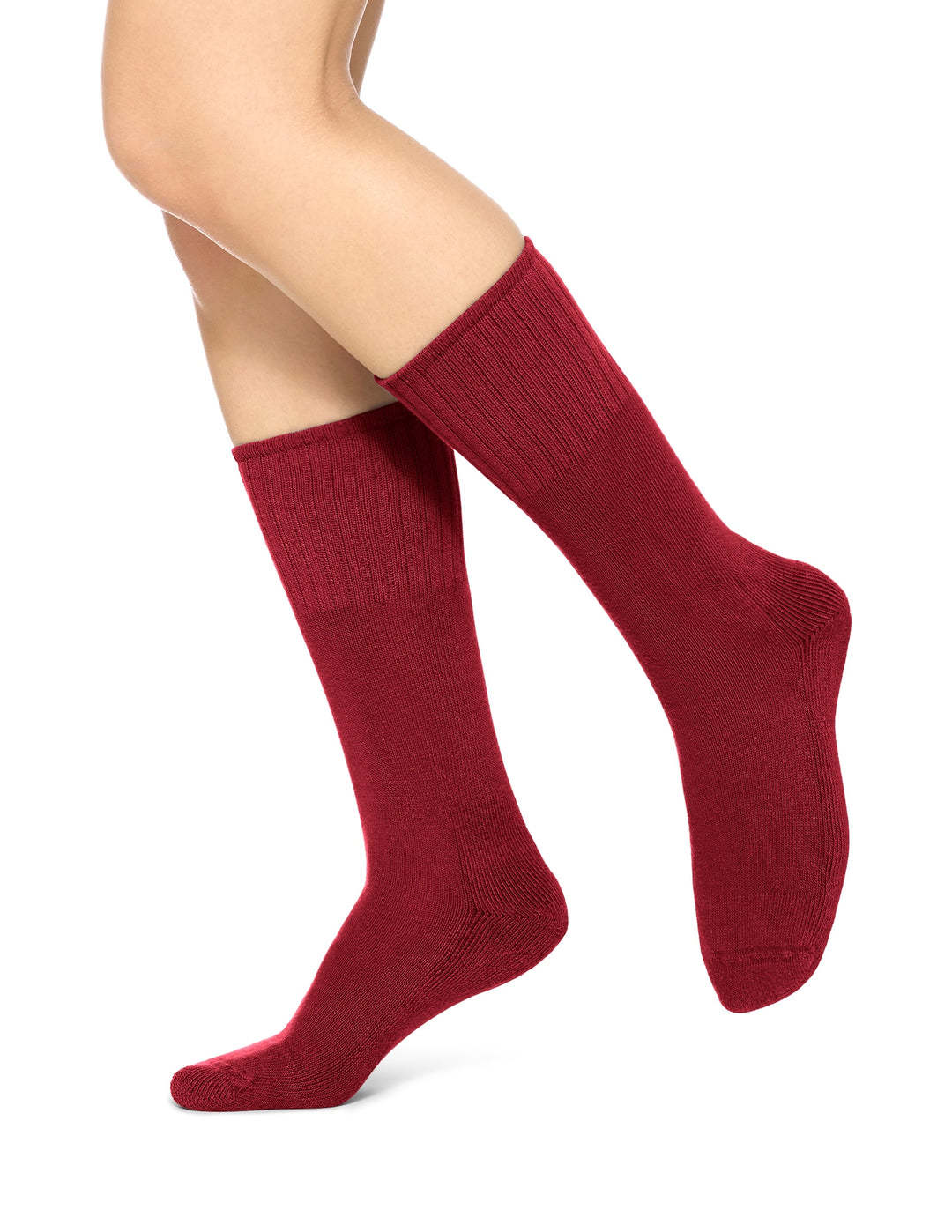 A pair of red crew-length boot socks on a person's legs, designed to be worn with boots.
