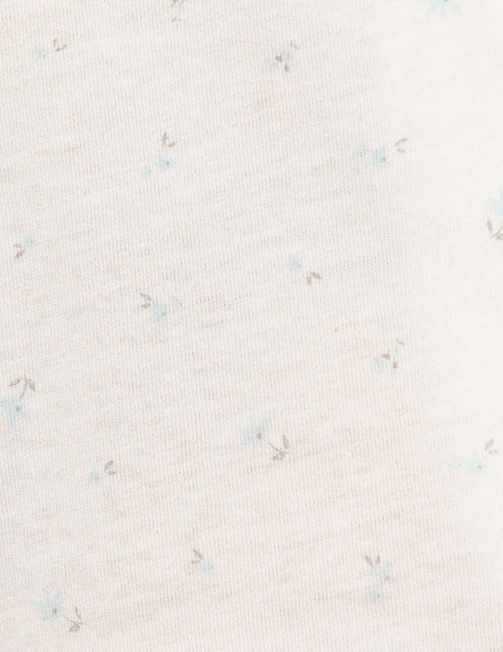 White fabric with blue flower detail