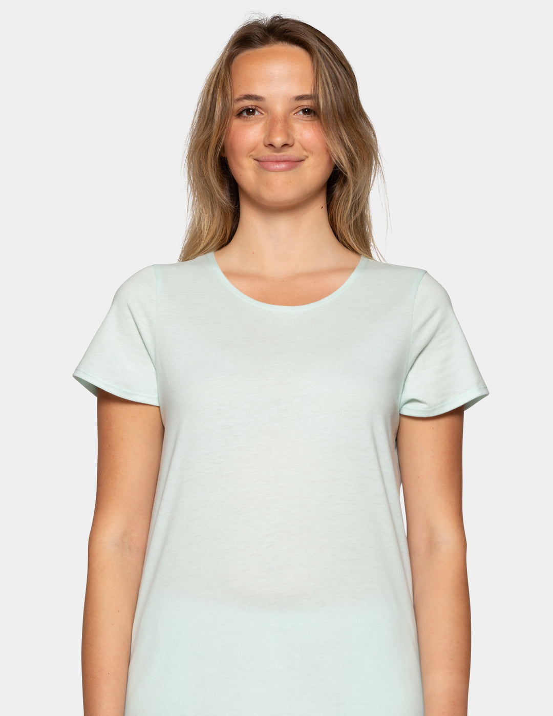 Woman wearing a pale blue pajama short sleeve tee