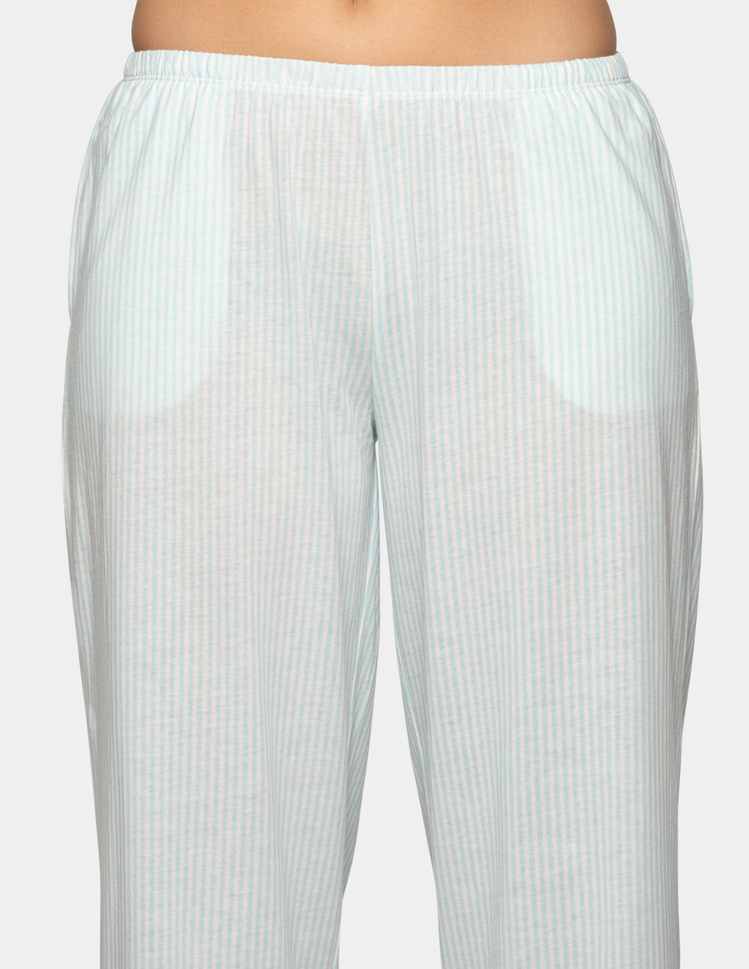 Woman wearing blue pajama stripe pants
