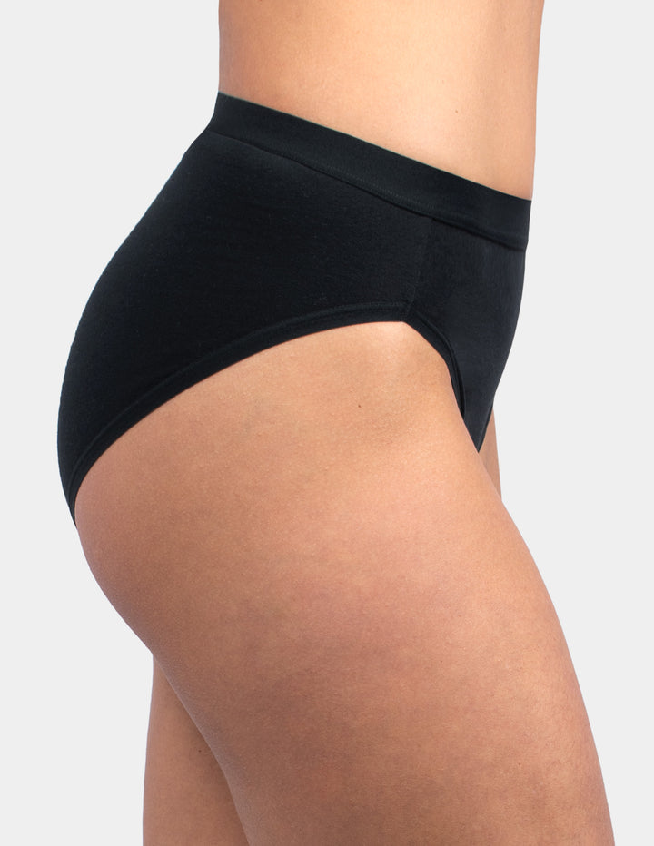 Woman wearing black brief underwear sideview