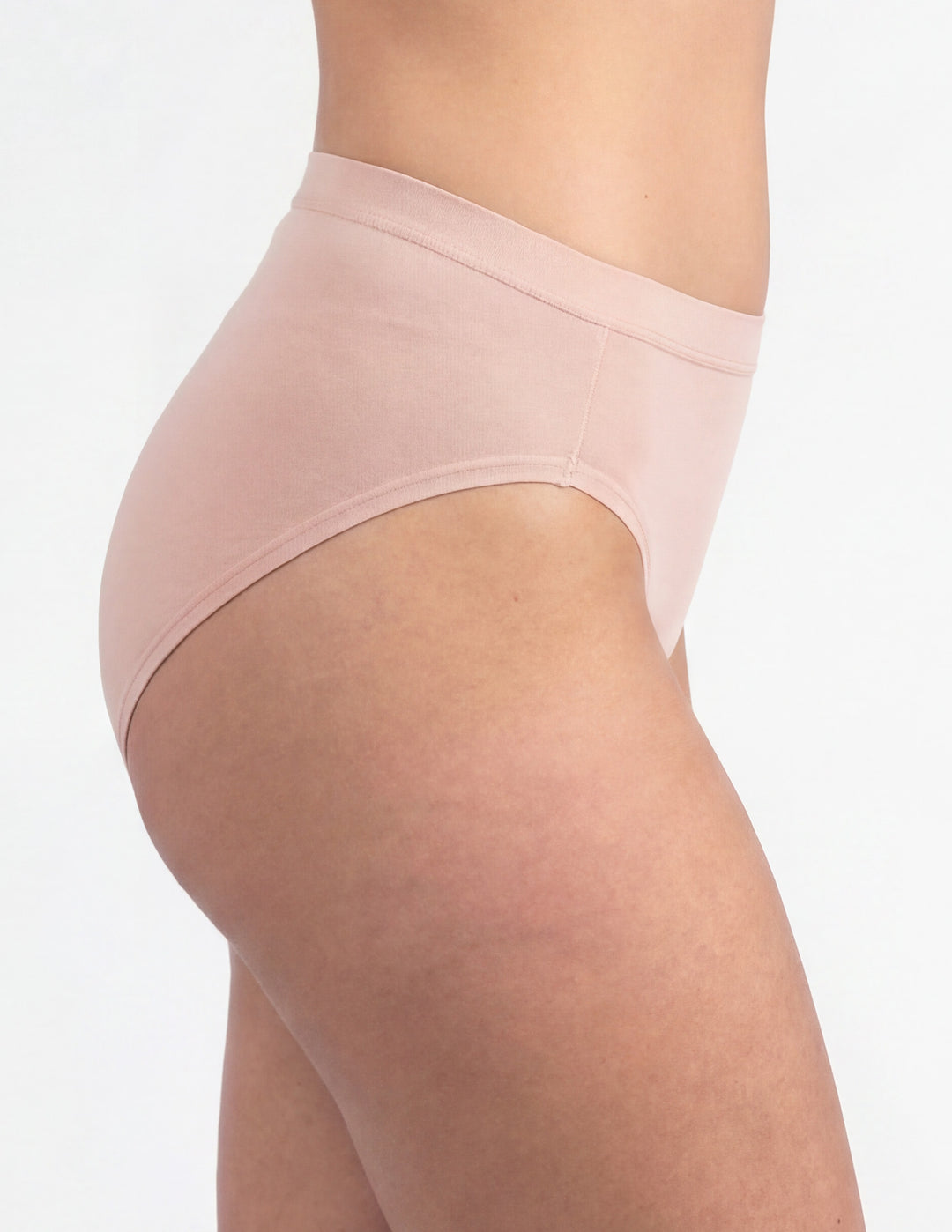 Woman wearing light pink brief underwear sideview