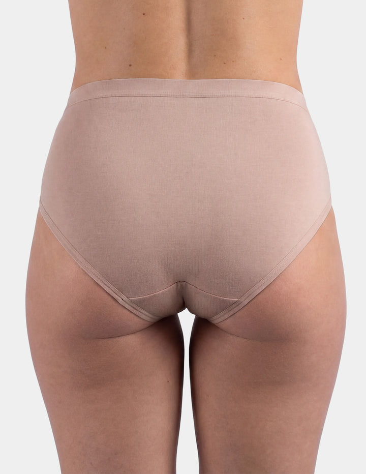 Woman wearing light pink brief underwear back view