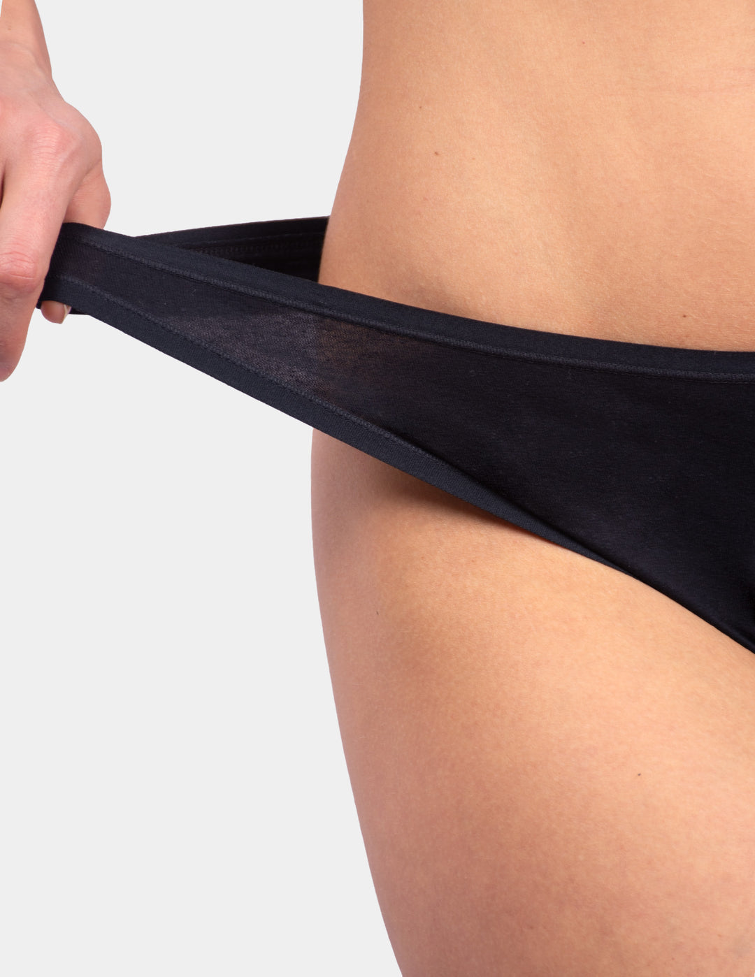 Woman wearing black thong underwear