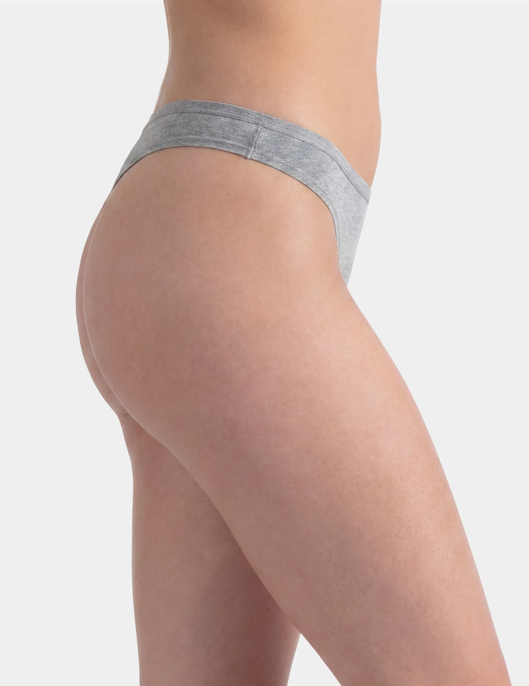 Woman wearing grey thong underwear sideview