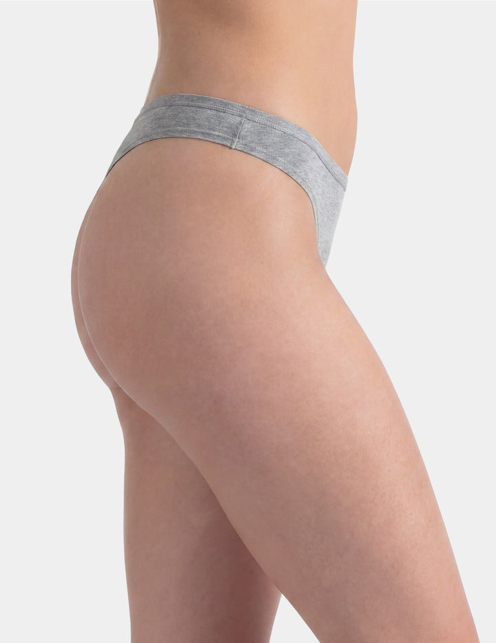Woman wearing grey thong underwear sideview