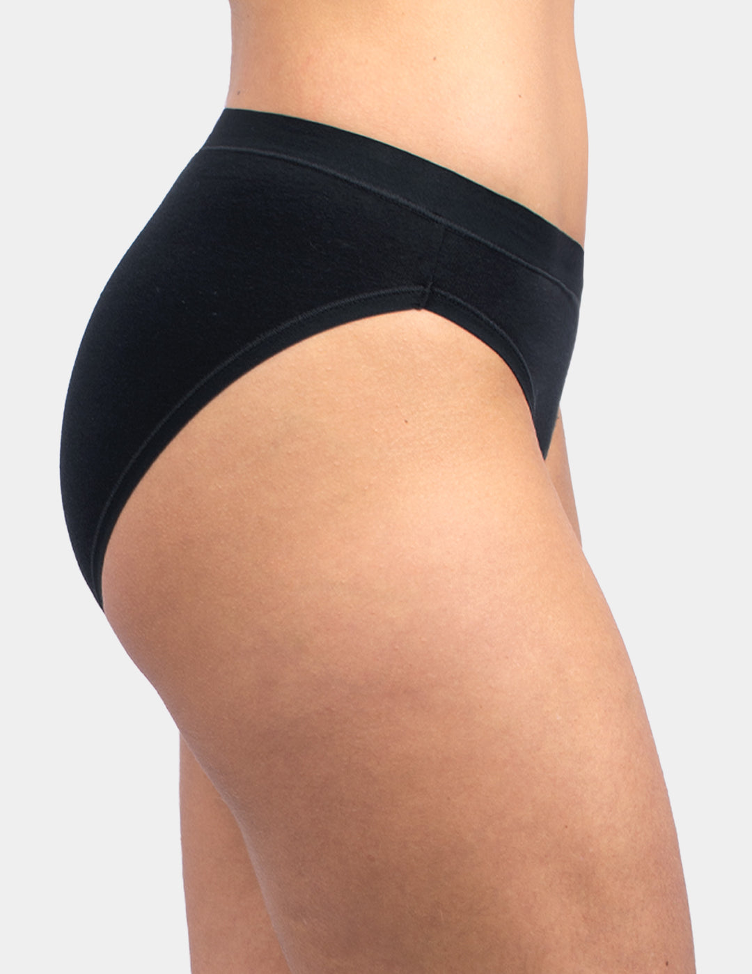 Woman wearing black bikini underwear sideview