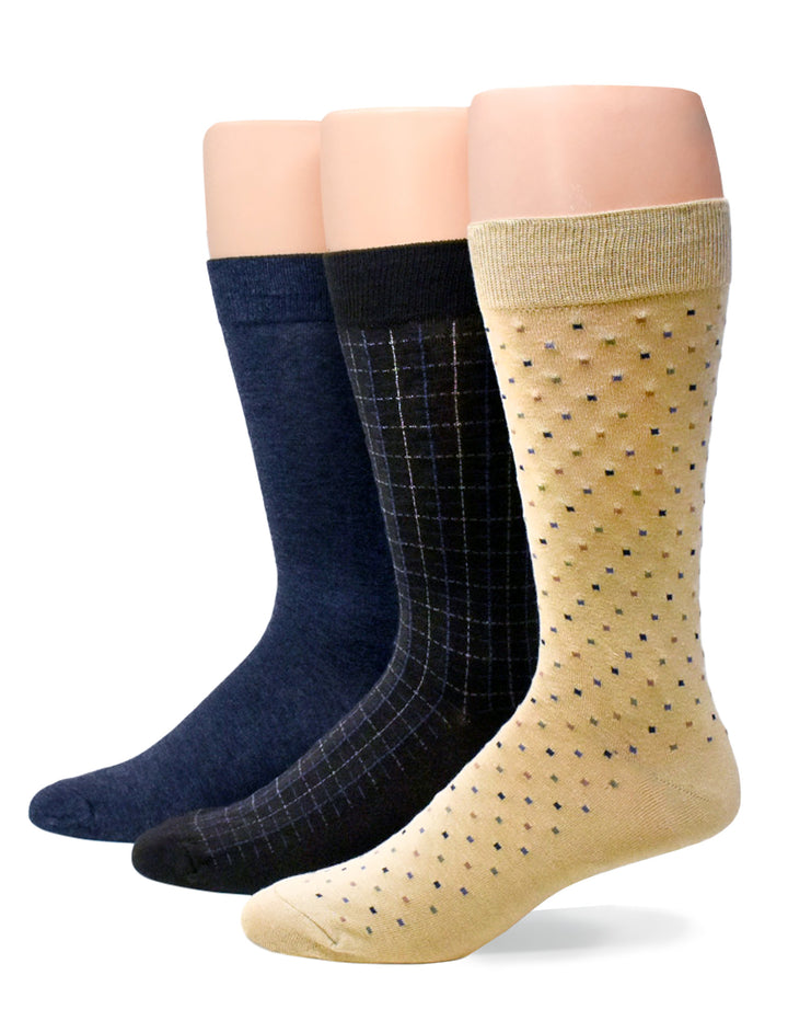Three pairs of socks in different patterns on a white background