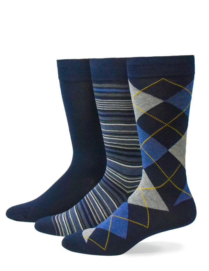 Three pairs of patterned men's socks on a white background