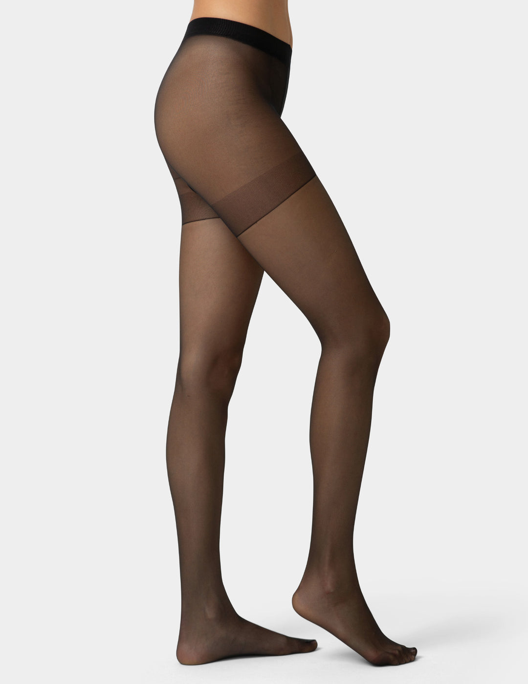 Person wearing black smart support control top sheers