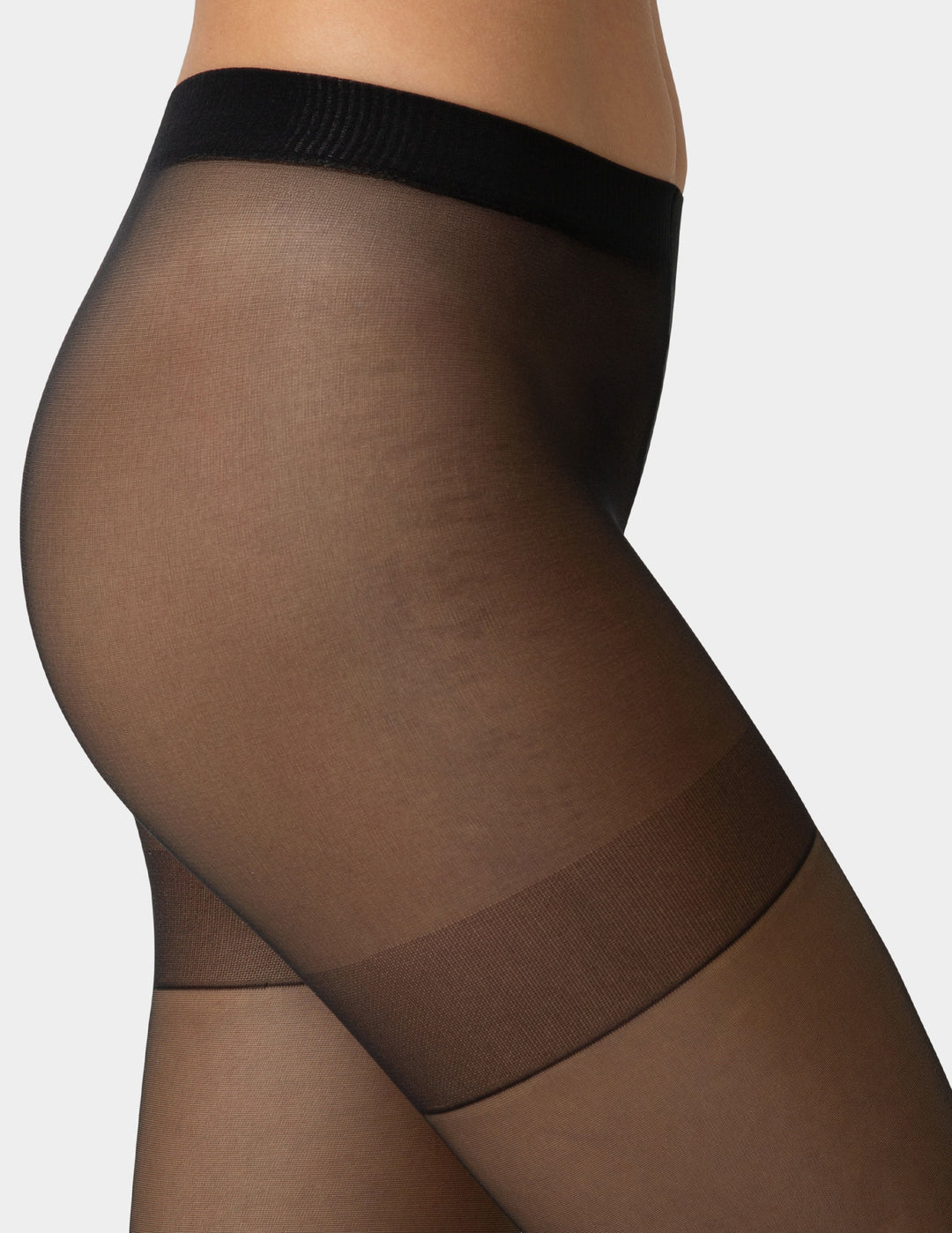 Up close shot of black smart support control top sheers worn by person 