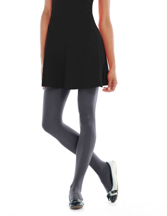A pair of sheer to waist tights in gray, displayed on a model wearing a black dress. The tights have a mid-rise waistband that sits just below the navel.
