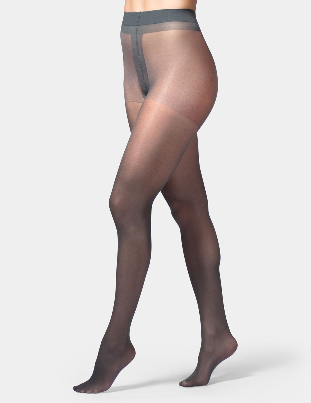 A model's legs wearing sheer, semi-transparent hosiery stockings with a solid gray waistband, shown against a light gray studio background.