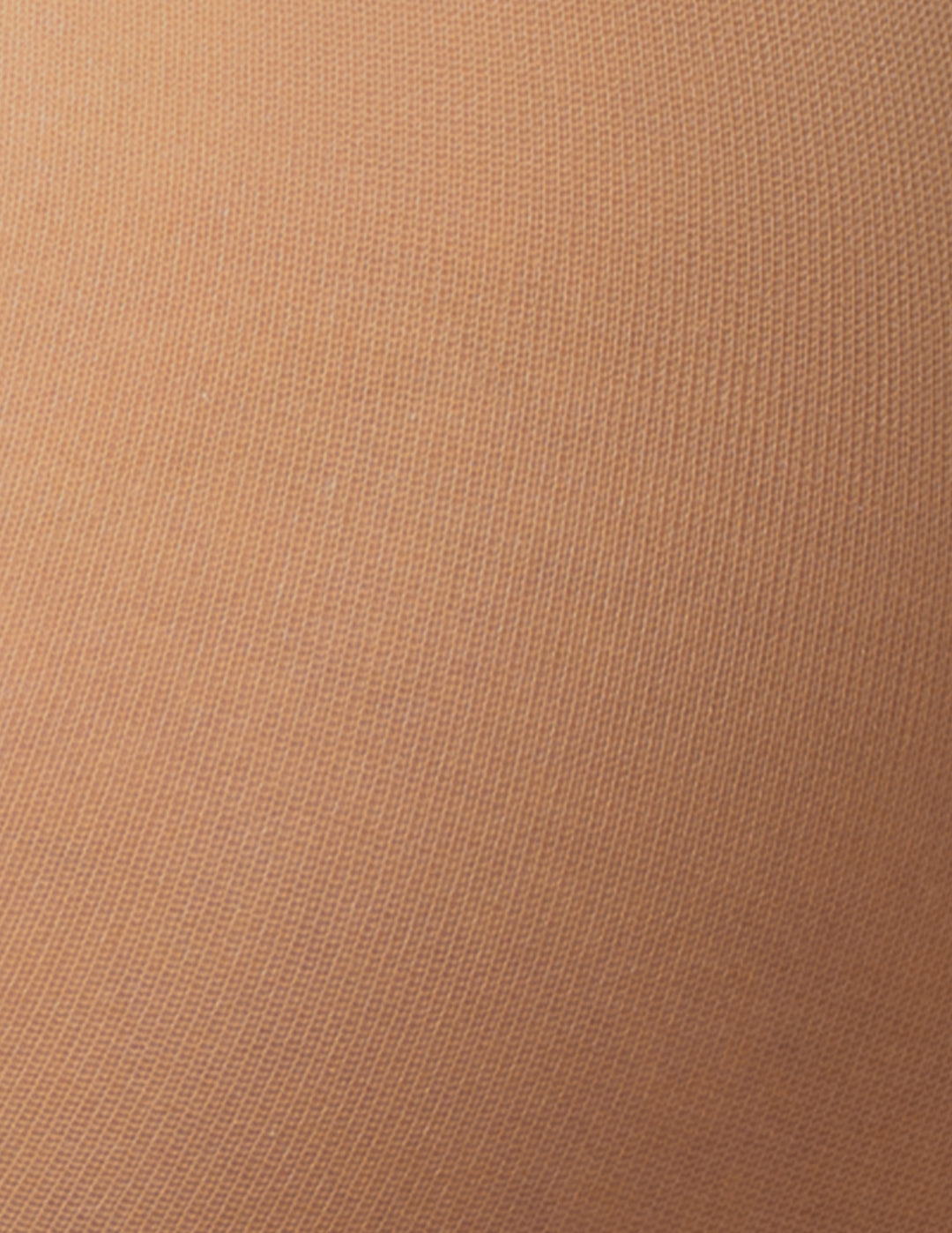 A close-up texture shot of a fine-knit fabric in a warm tan or camel color.