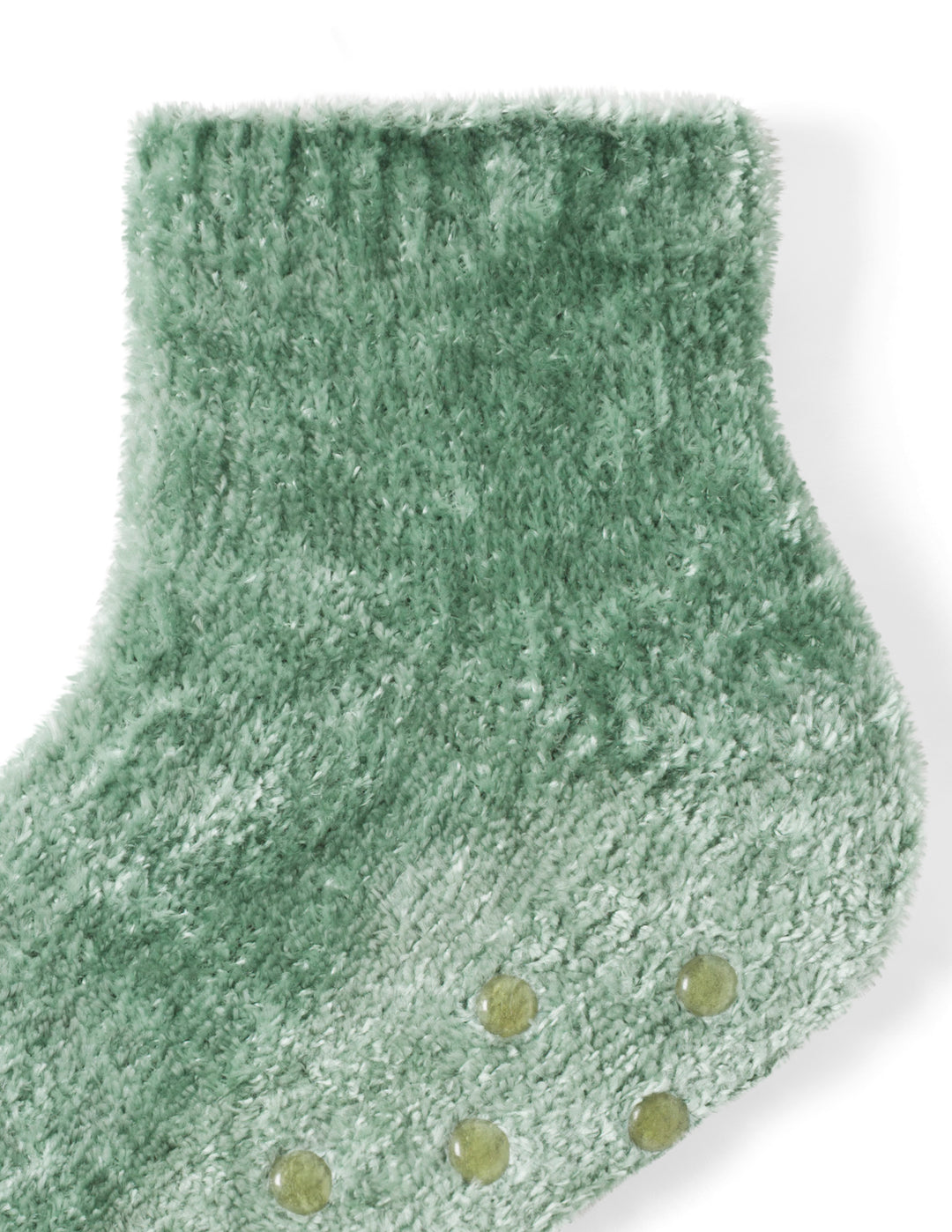 Green fuzzy socks with textured sole on a white background