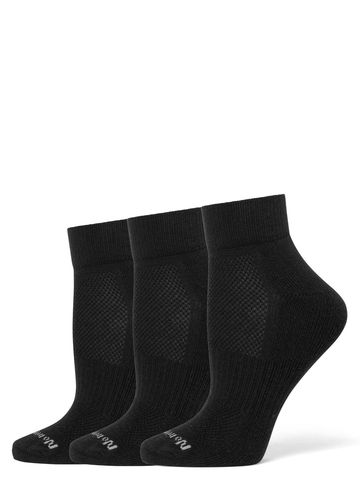 Three pairs of black ankle socks on a white background