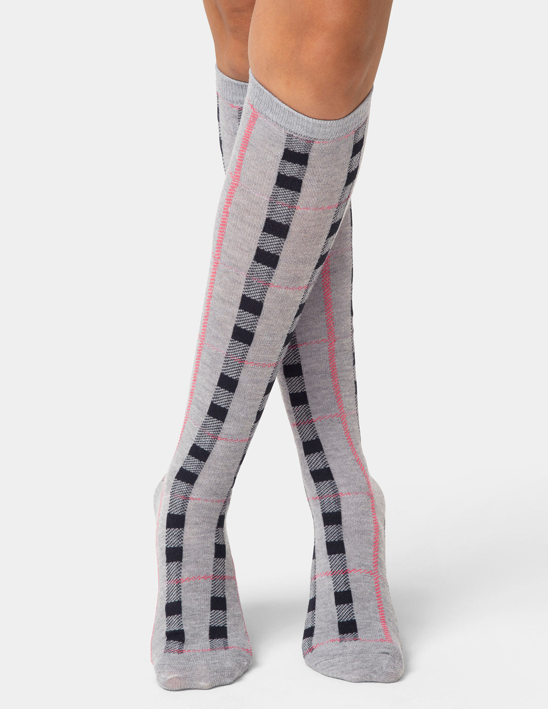 Gray knee-high socks with black and pink checkered pattern worn by a person on a white background