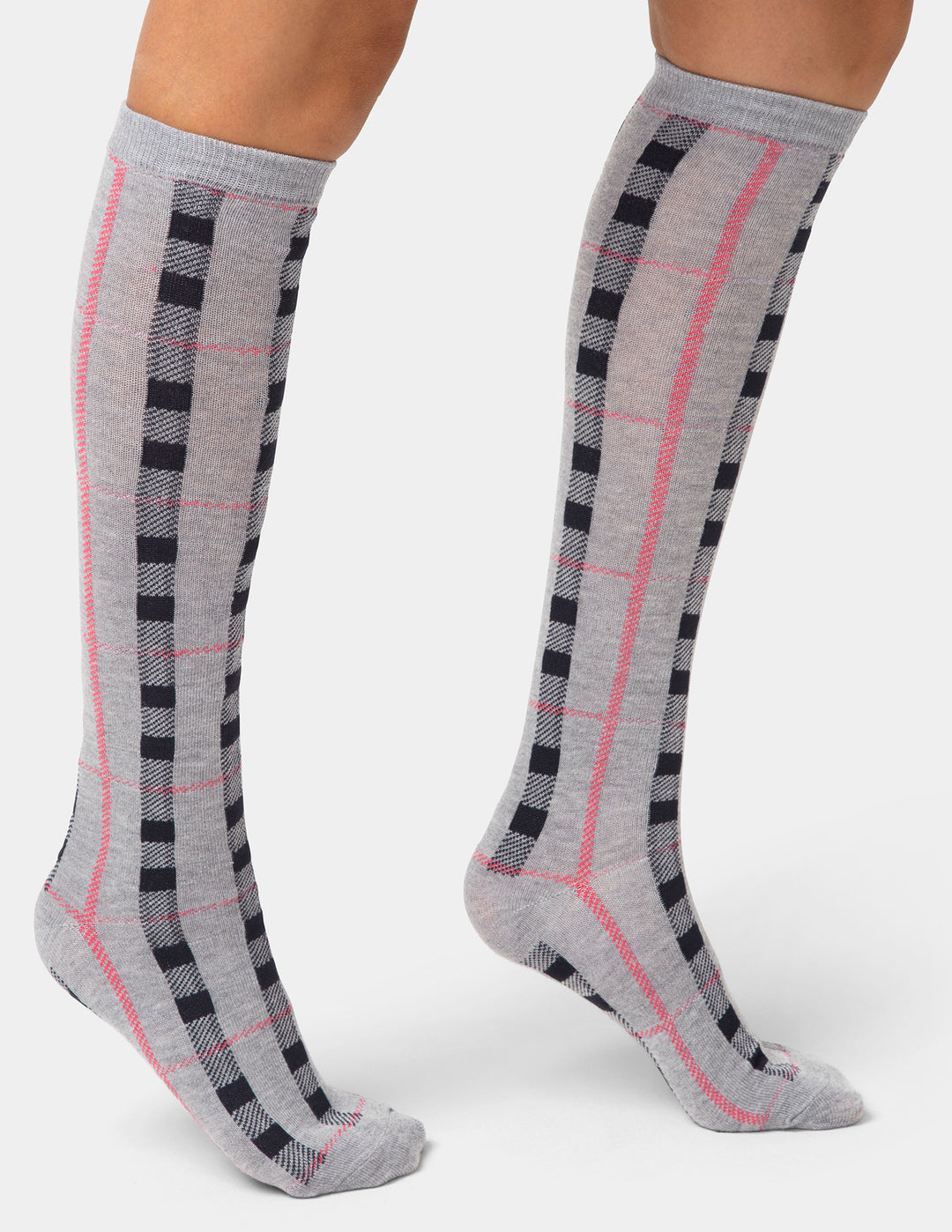 Gray knee-high socks with black and pink checkered pattern worn by a person on a white background