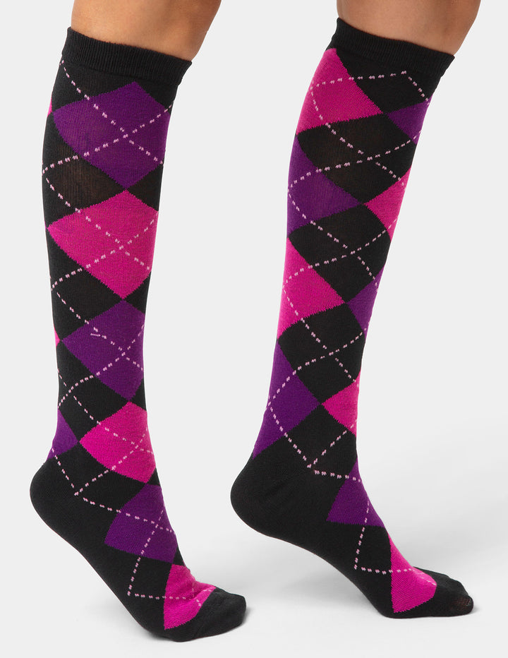 Knee-high socks with a purple and pink argyle pattern on a white background