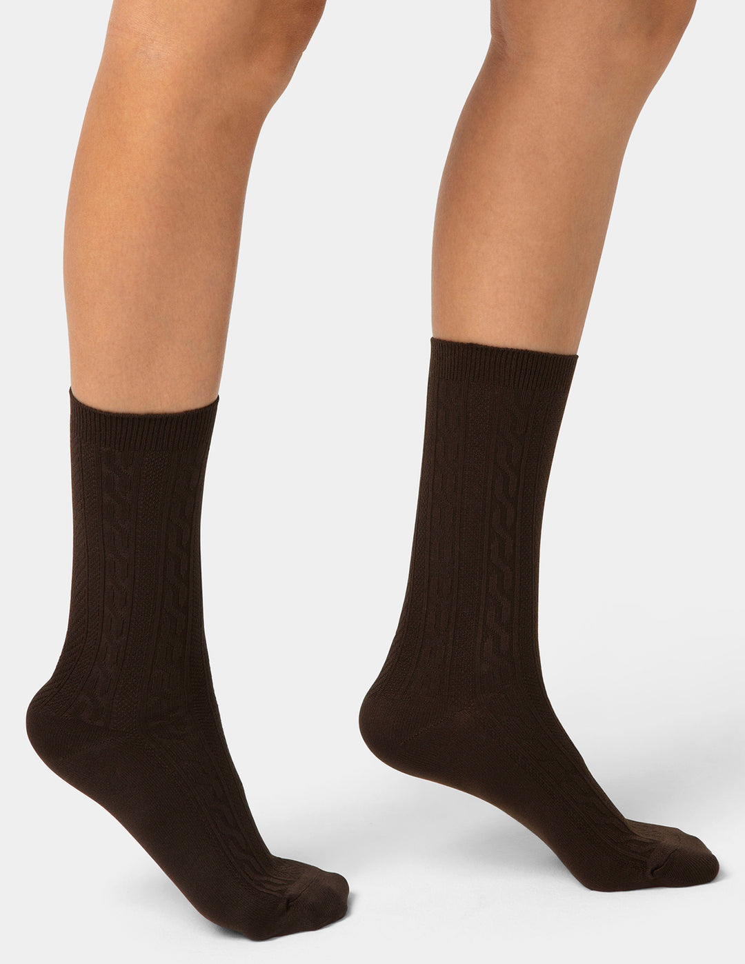 Brown socks worn by a person on a white background