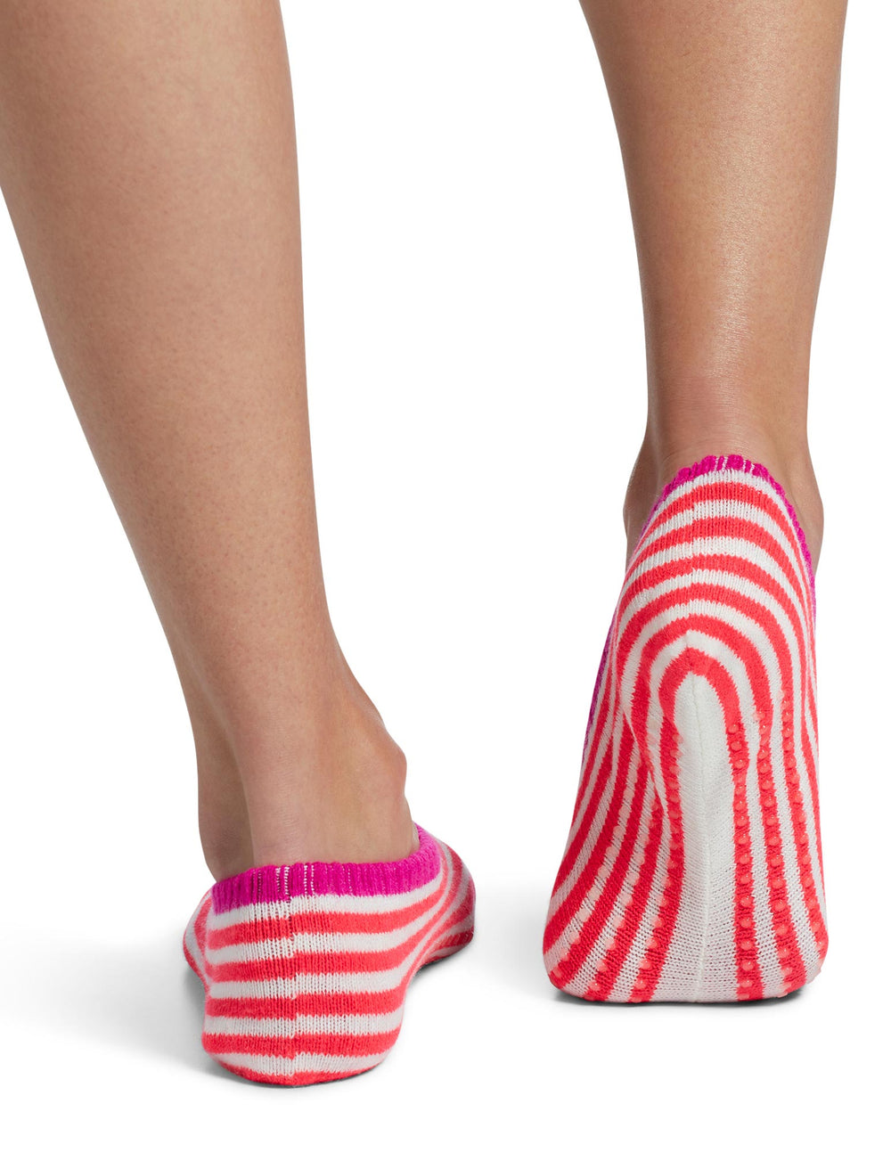 Person wearing and showing bottom of slipper sock in cherry