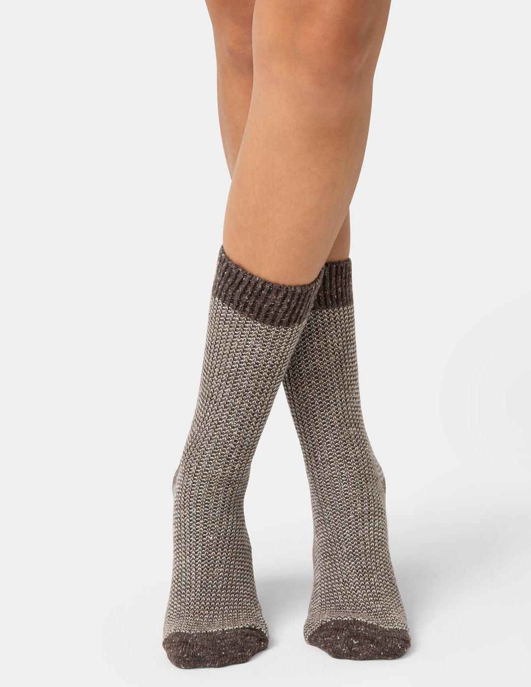 Pair of brown knitted socks on a white background