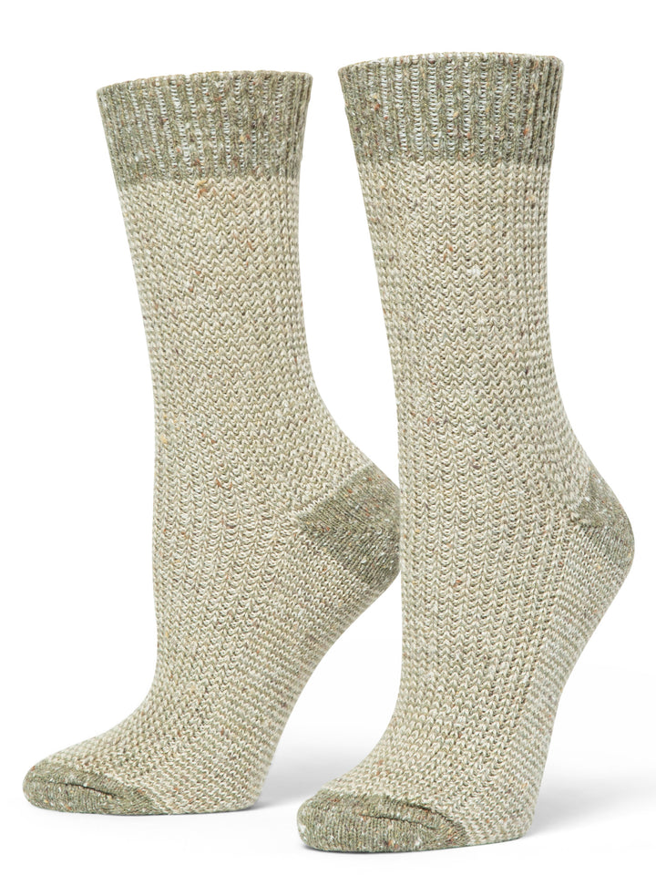 Pair of beige knitted socks on a white background