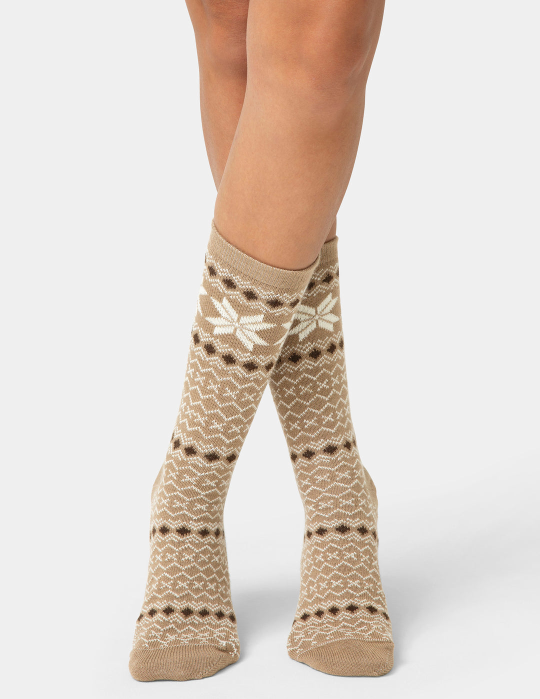 Patterned socks worn by a person on a white background