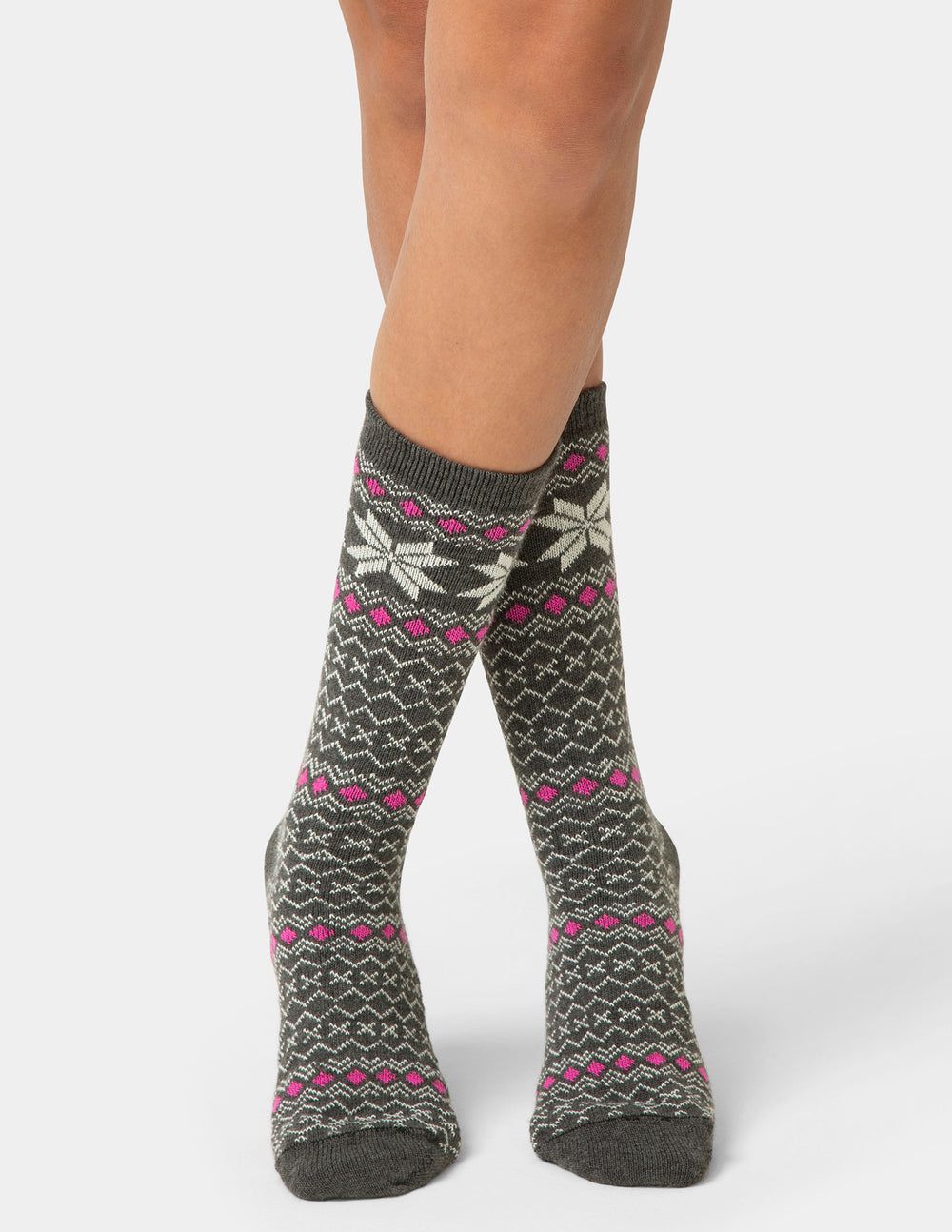 Patterned socks worn by a person on a white background