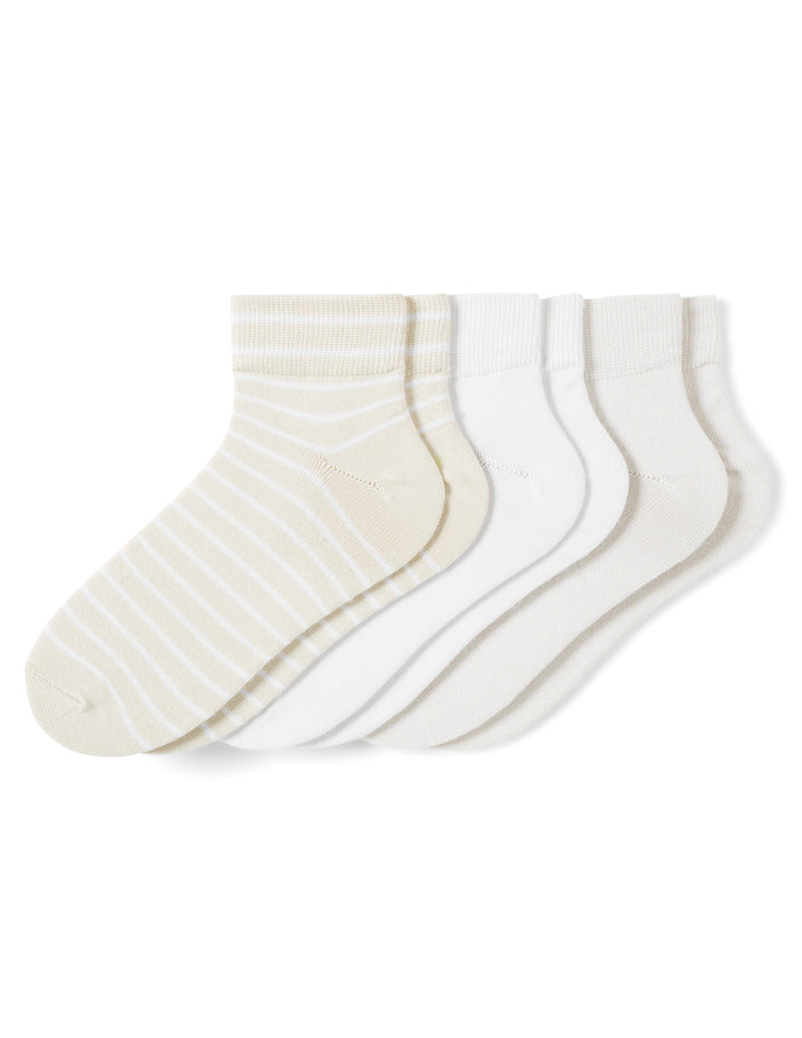 Set of three pairs of white socks with thin stripes on a white background