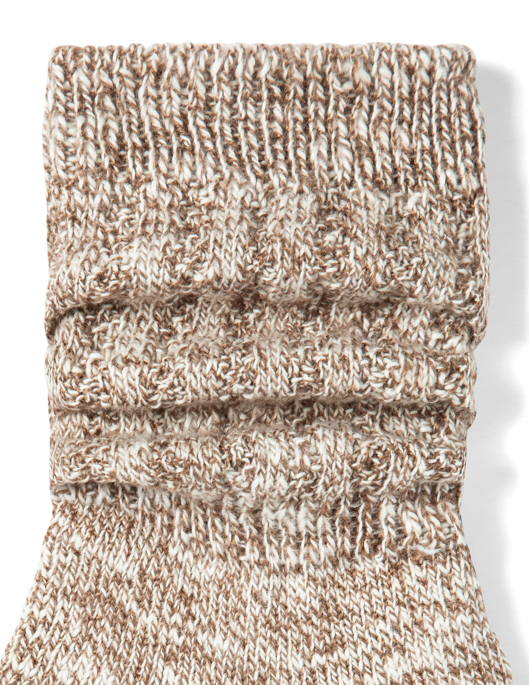 Knitted sock with a ribbed texture on a white background