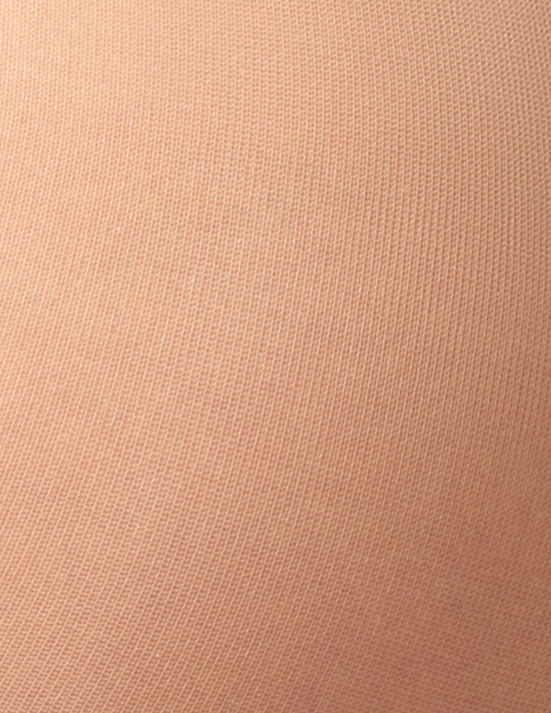 A close-up texture shot of a fine-knit fabric in a warm beige color.