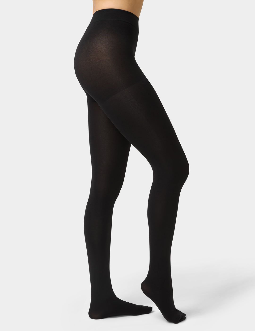 Black tights worn by a person on a white background